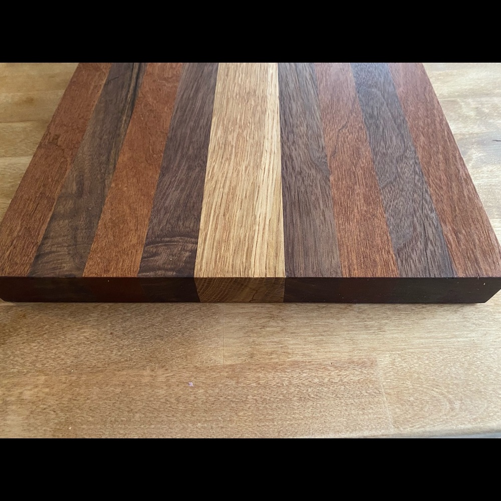 Handcrafted cutting board made with oak, black walnut, and mahogany